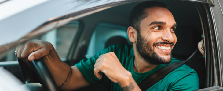 Smiling driver at the wheel